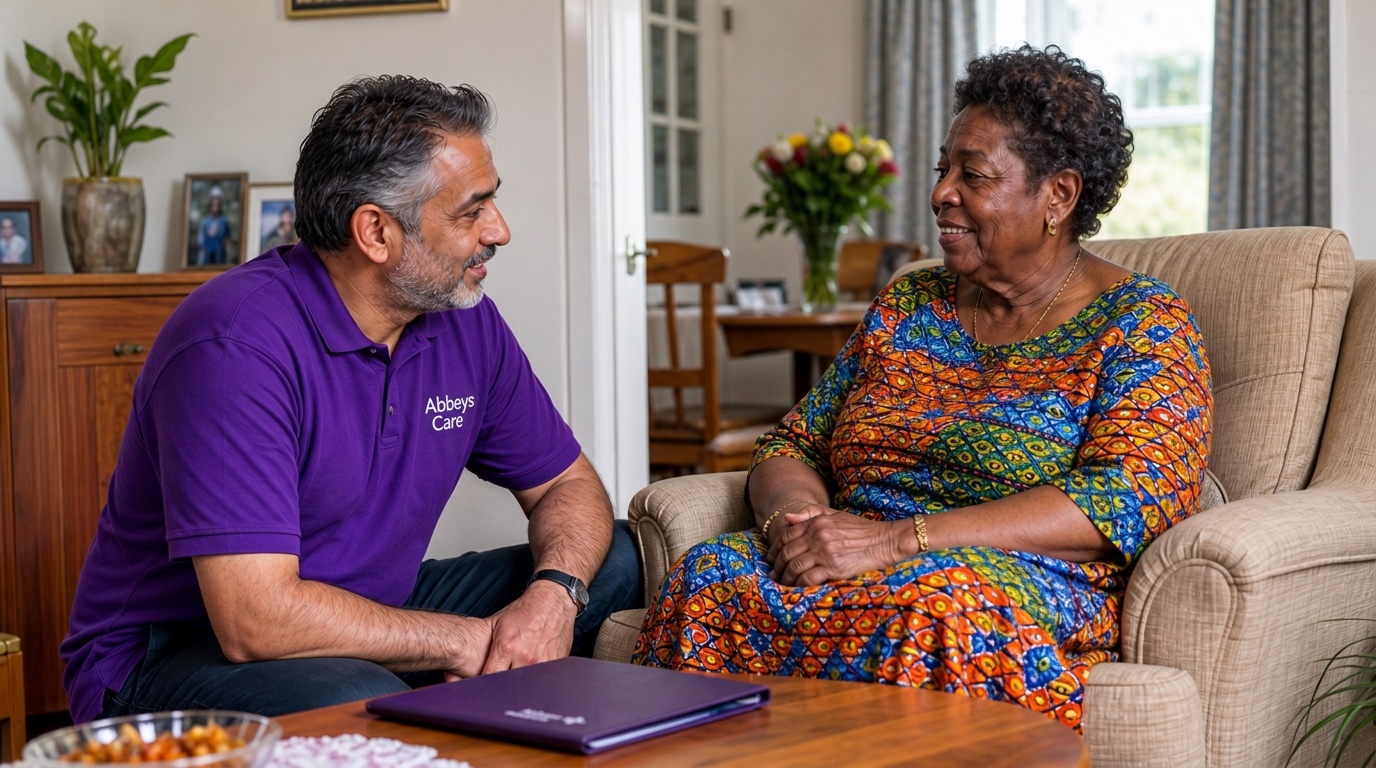Abbeys Care support worker in purple branded uniform reviewing a personalised care plan with a gentleman at home in Newham